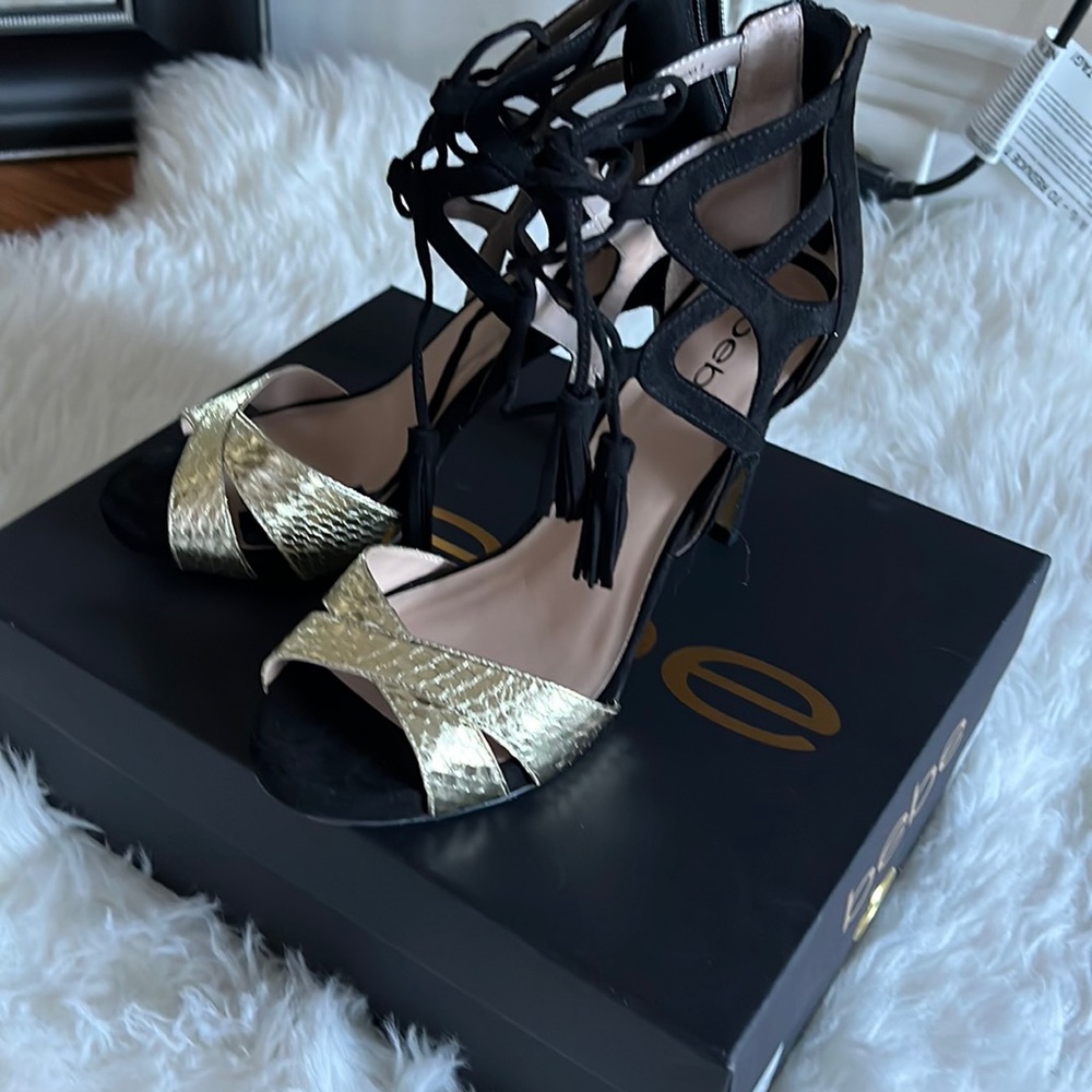 Bebe Lea black and gold size 8, tasseled tie sandal